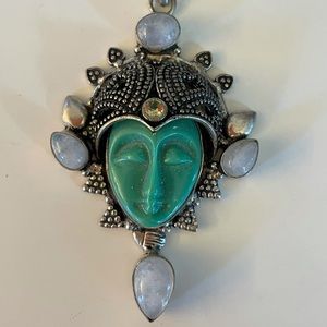 Hand-detailed pendant. Gorgeous stones and craftsmanship
